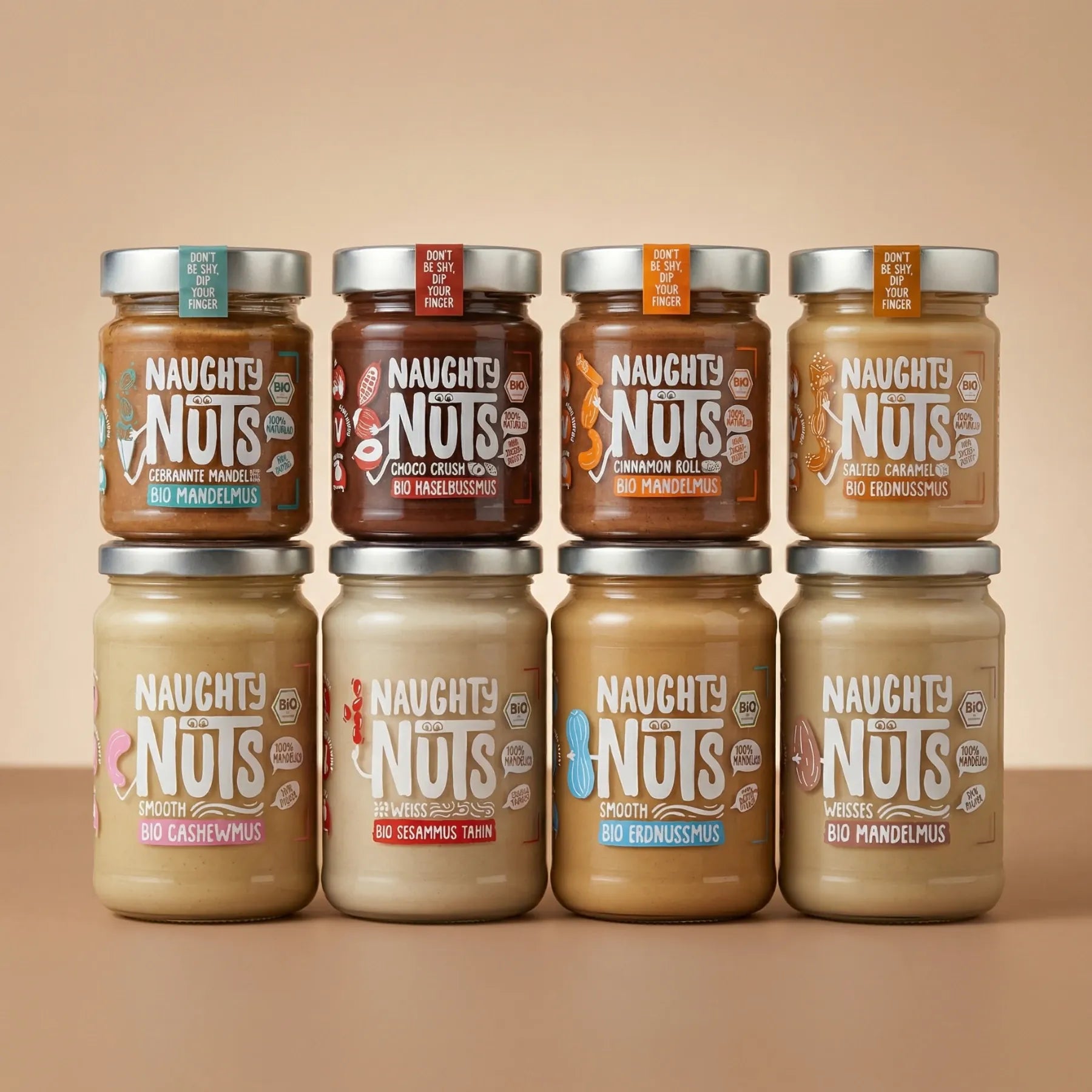 Großes Nussmus Bundle mit acht Naughty Nuts Gläsern in zwei Reihen